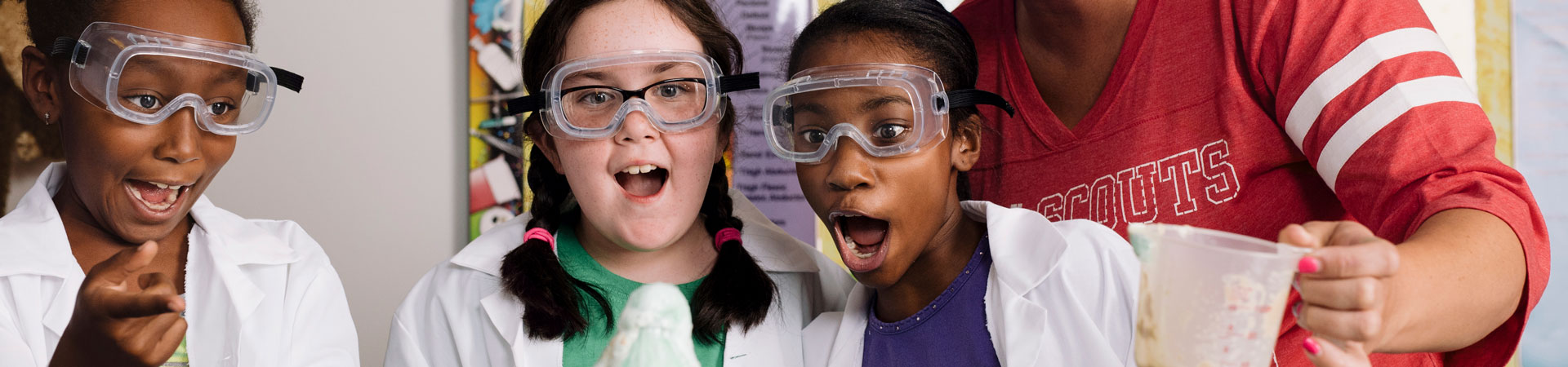  Group of Junior Girl Scouts smiling and laughing outdoors 